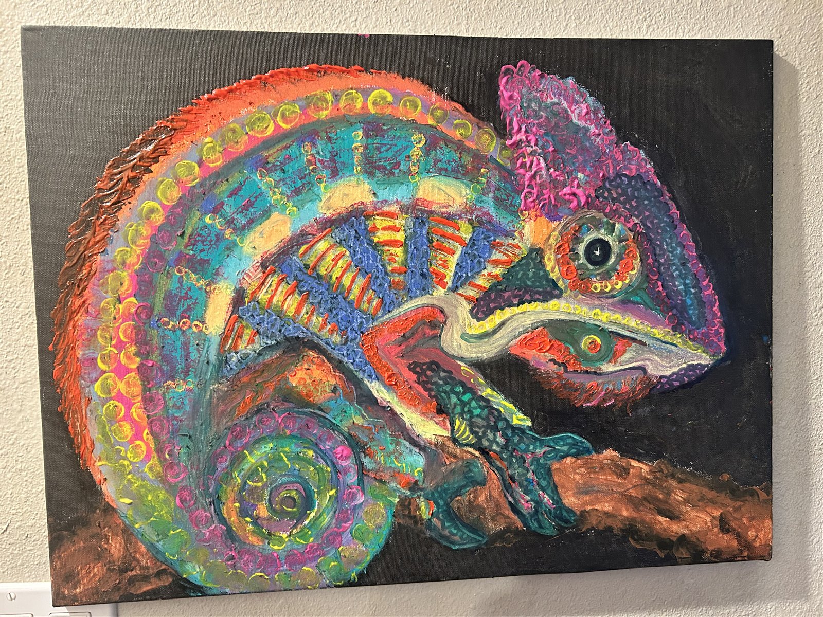 Vividly colored textured chameleon painting on a copper branch by Stephanie Dill